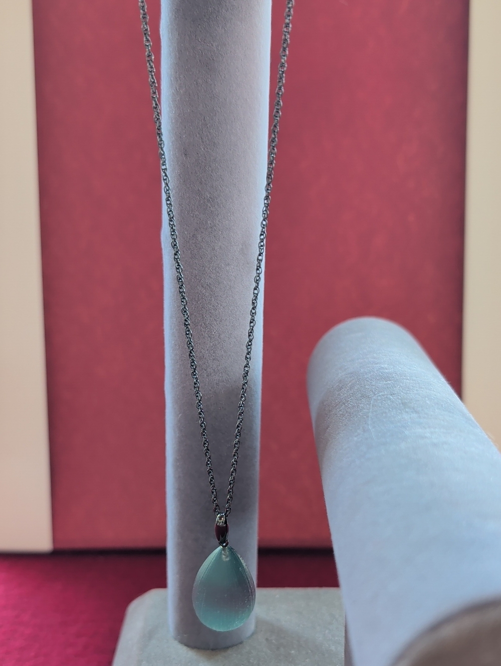 Alexis Bittar teardrop blue green lucite pendant on dark chain